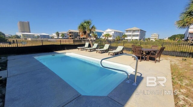 view of pool featuring a patio area