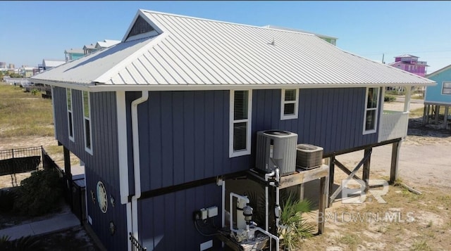 view of side of home featuring cooling unit