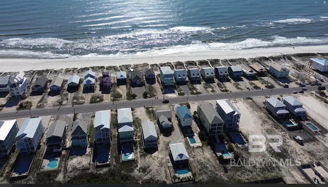 aerial view with a beach view and a water view