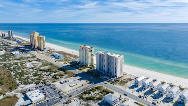 aerial view with a water view, a view of the beach, and a city view