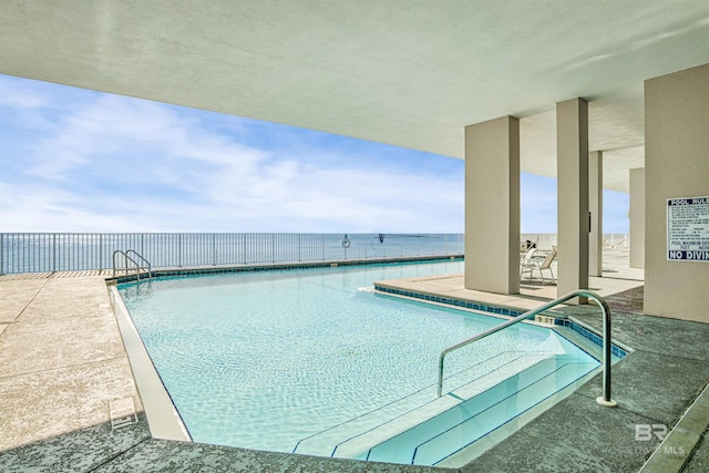 view of swimming pool with a patio area