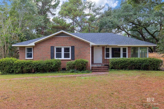 single story home with a front yard