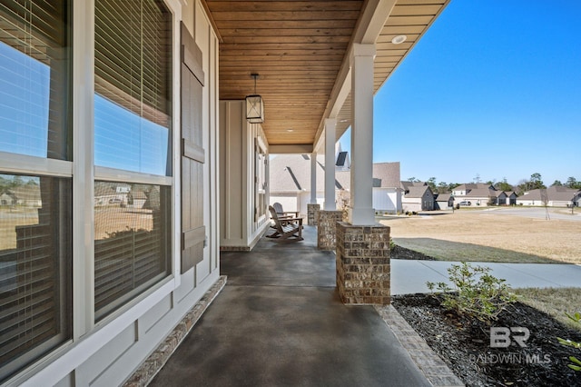 view of patio with a porch and a residential view