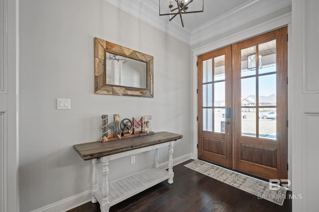 entryway featuring baseboards, ornamental molding, dark wood-style flooring, french doors, and a notable chandelier