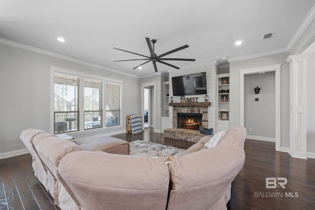 living room featuring baseboards, visible vents, dark wood-style floors, ornamental molding, and a brick fireplace