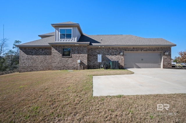 exterior space with an attached garage, brick siding, driveway, and a front yard