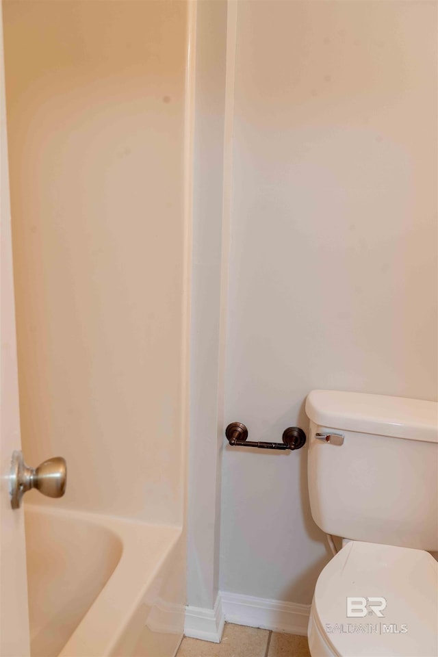 full bath with toilet, baseboards, a shower, tile patterned floors, and a bathtub