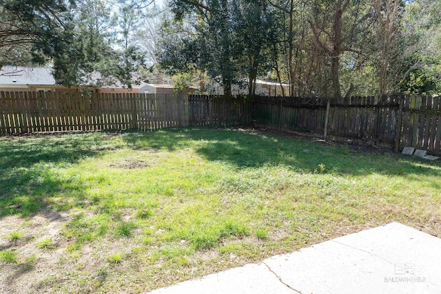 view of yard with a fenced backyard