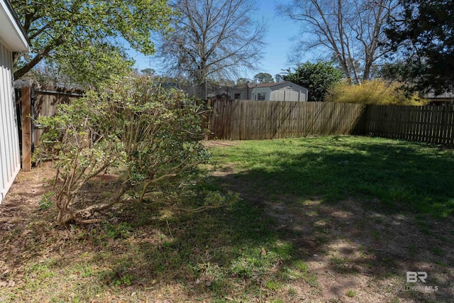 view of yard with a fenced backyard