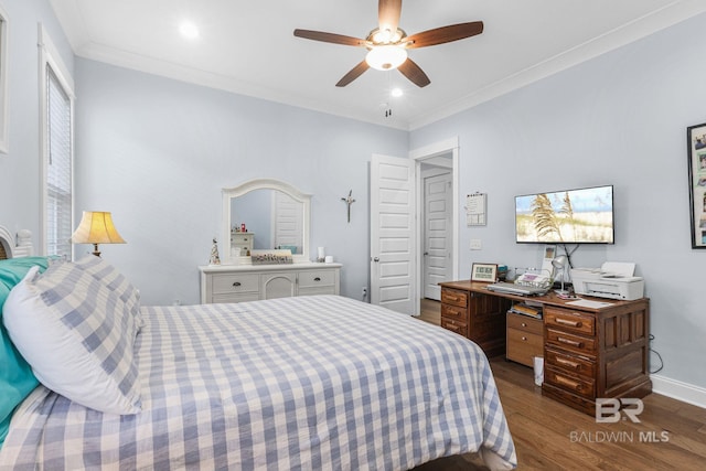 bedroom featuring ornamental molding, ceiling fan, and dark wood-type flooring