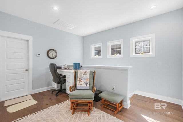 office with hardwood / wood-style flooring