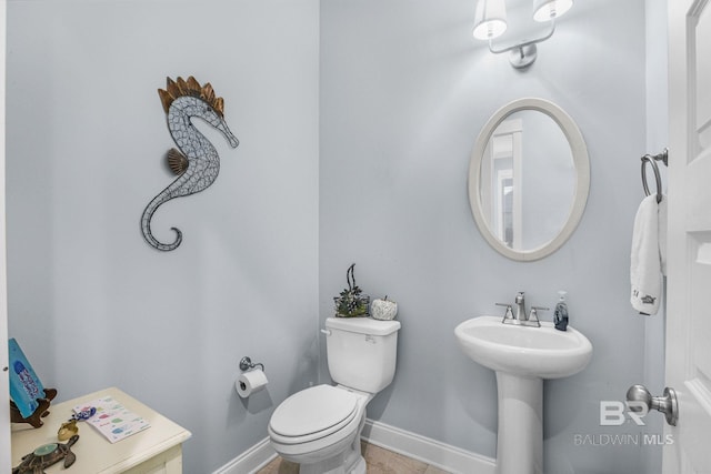 bathroom featuring tile patterned flooring and toilet