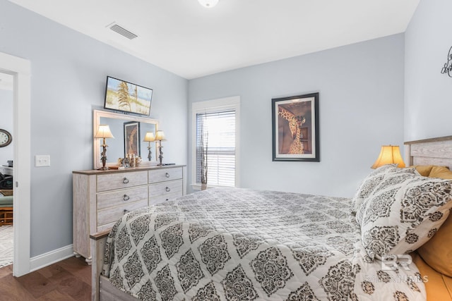 bedroom with dark hardwood / wood-style flooring