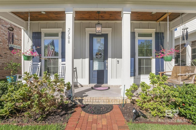 property entrance featuring a porch