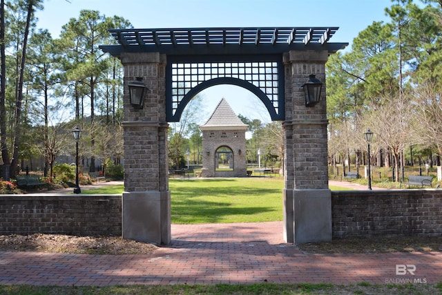 view of home's community with a yard