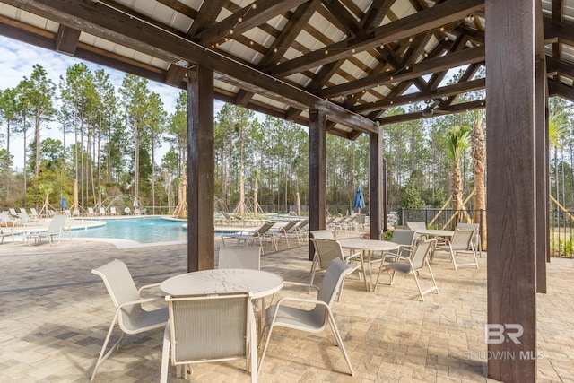 view of patio / terrace featuring a community pool and a gazebo