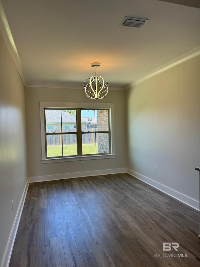 unfurnished room featuring crown molding, a chandelier, and dark wood-type flooring