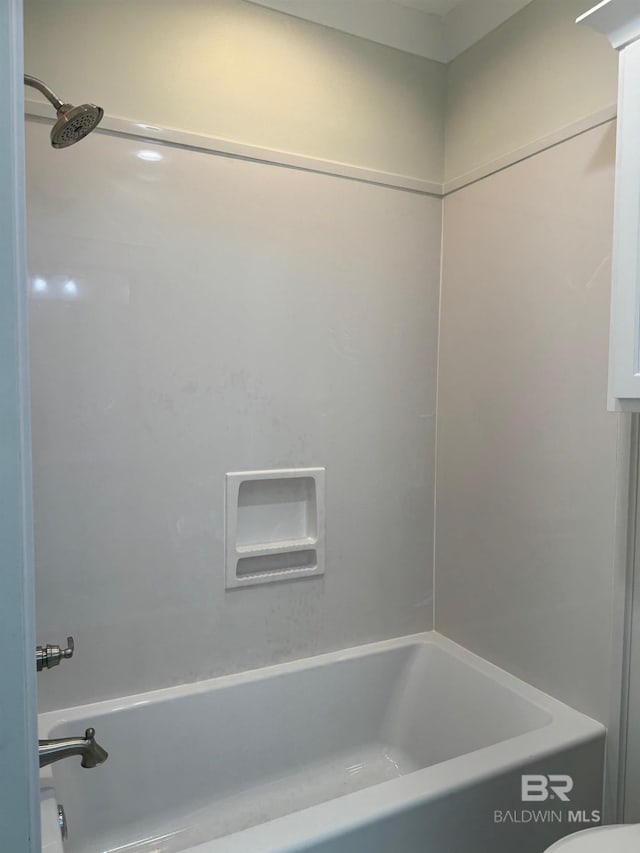 bathroom with shower / washtub combination