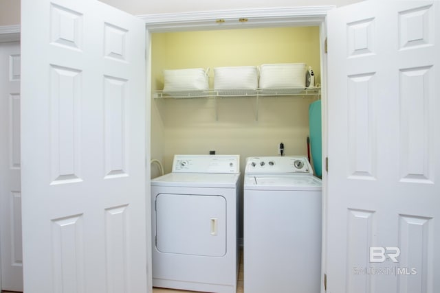 washroom featuring laundry area and washing machine and dryer