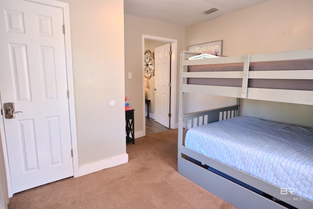 unfurnished bedroom with light colored carpet