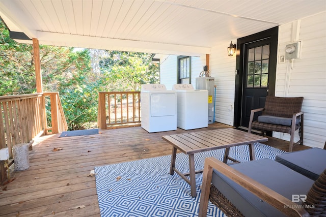 wooden terrace with separate washer and dryer and water heater