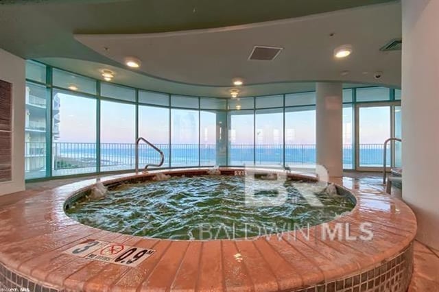 26302 Perdido Beach Blvd Unit D-704, Orange Beach, AL 36561 - view of swimming pool with a hot tub and a water view