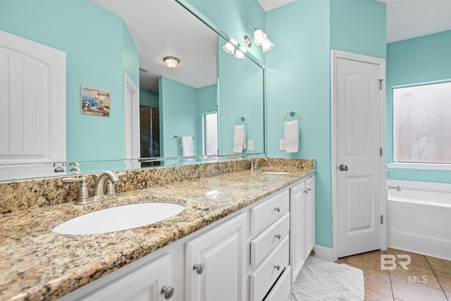 2554 Masters Ct, Mobile, AL 36618 - bathroom with double vanity, a garden tub, tile patterned flooring, and a shower