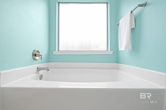 2554 Masters Ct, Mobile, AL 36618 - bathroom with a garden tub and a textured wall