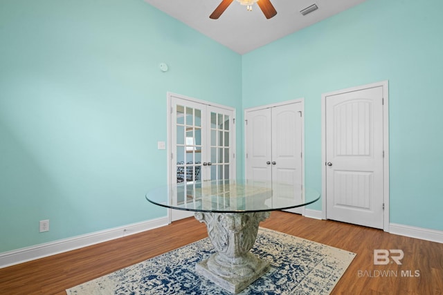 2554 Masters Ct, Mobile, AL 36618 - dining area with wood finished floors, ceiling fan, and high vaulted ceiling