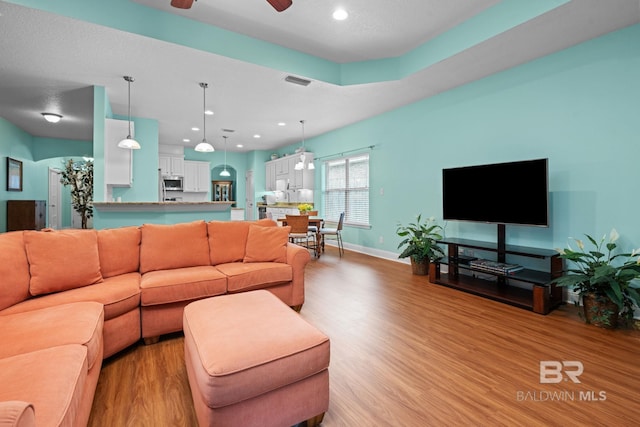 2554 Masters Ct, Mobile, AL 36618 - living area featuring light wood finished floors, a ceiling fan, and recessed lighting