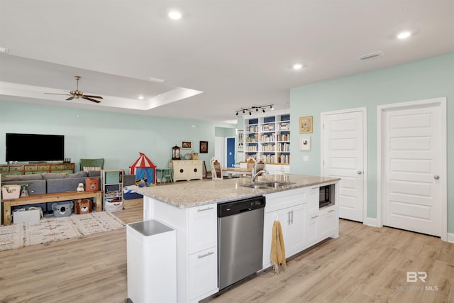 kitchen featuring white cabinetry, an island with sink, sink, stainless steel dishwasher, and light wood-type flooring