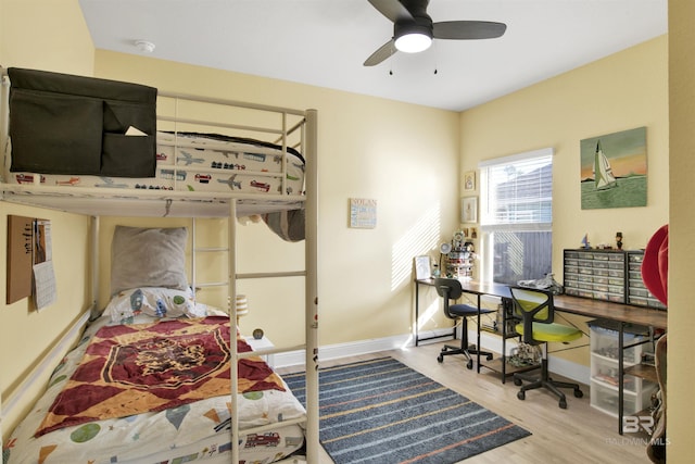 bedroom featuring hardwood / wood-style flooring and ceiling fan