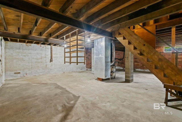 basement featuring heating unit