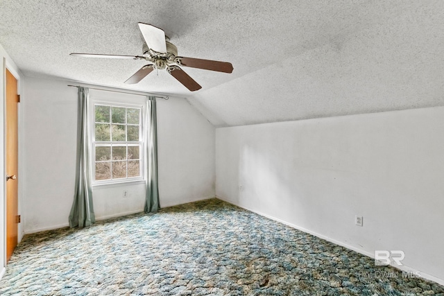 additional living space featuring carpet flooring, ceiling fan, lofted ceiling, and a textured ceiling