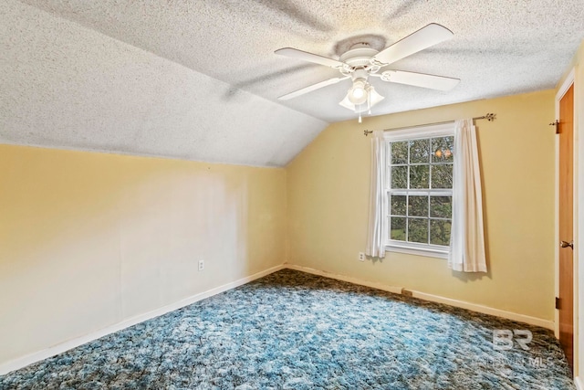 bonus room with carpet flooring, ceiling fan, lofted ceiling, and a textured ceiling