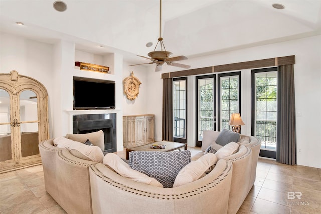 living room featuring light tile patterned flooring and ceiling fan