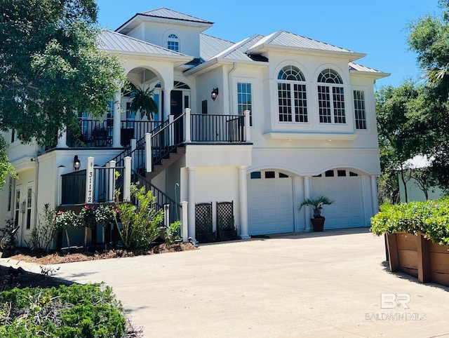 mediterranean / spanish-style home with a garage