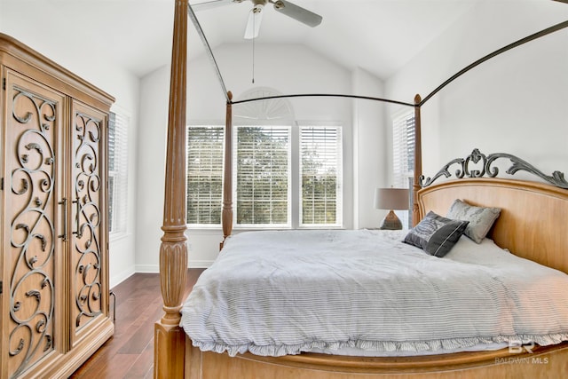 bedroom featuring ceiling fan, vaulted ceiling, and dark hardwood / wood-style flooring