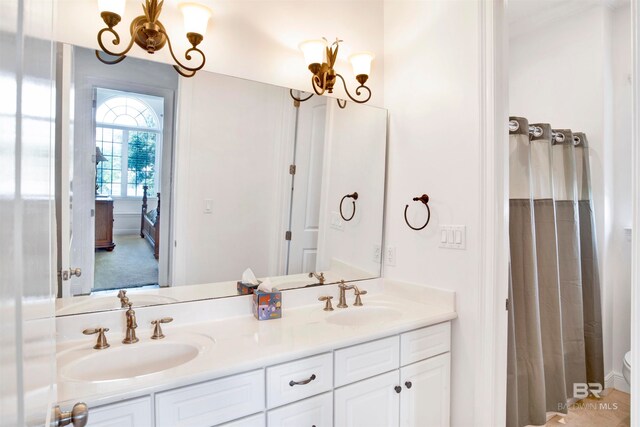 bathroom featuring toilet and vanity