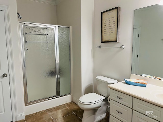 bathroom with an enclosed shower, toilet, tile patterned floors, vanity, and crown molding