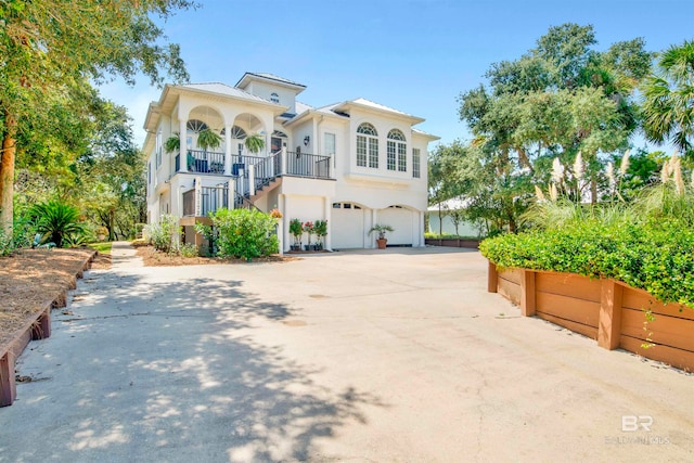 mediterranean / spanish-style house featuring a garage