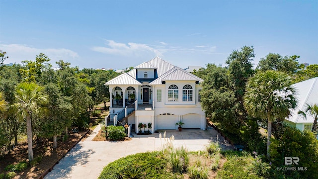 mediterranean / spanish home featuring a garage