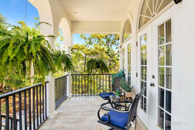 balcony featuring french doors