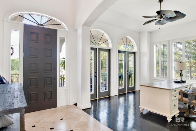 entrance foyer with french doors, ceiling fan, and dark hardwood / wood-style floors