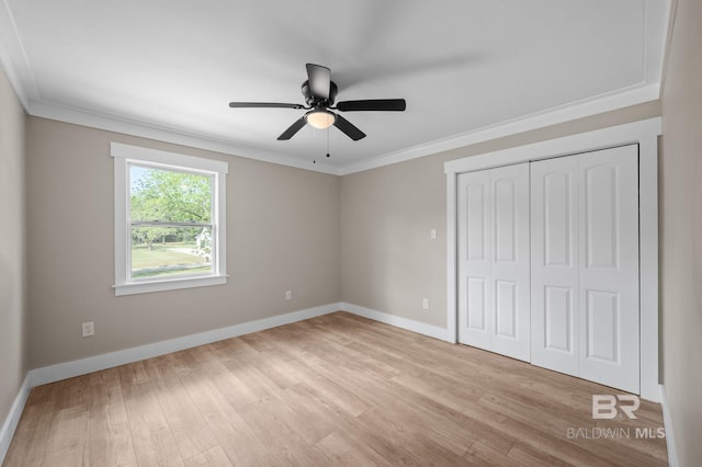 751 Abbey Way, Mobile, AL 36695 - unfurnished bedroom with ornamental molding, baseboards, light wood-type flooring, a closet, and ceiling fan