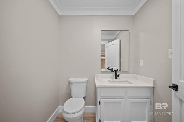751 Abbey Way, Mobile, AL 36695 - half bath with ornamental molding, vanity, toilet, baseboards, and wood finished floors