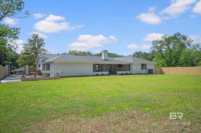 751 Abbey Way, Mobile, AL 36695 - back of house with central AC, brick siding, a chimney, and a deck