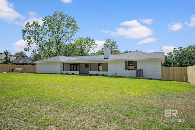751 Abbey Way, Mobile, AL 36695 - rear view of property with central air condition unit, a chimney, and brick siding