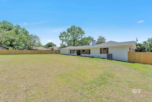 751 Abbey Way, Mobile, AL 36695 - back of property featuring a chimney, brick siding, and central AC