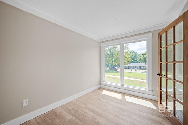 751 Abbey Way, Mobile, AL 36695 - spare room with baseboards, light wood-style flooring, and crown molding